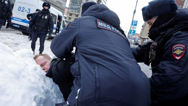 Police detain a man at a gathering in memory of Alexei Navalny at the Wall of Grief in Moscow, a monument to the victims of political repression. Picture: Reuters/The Times