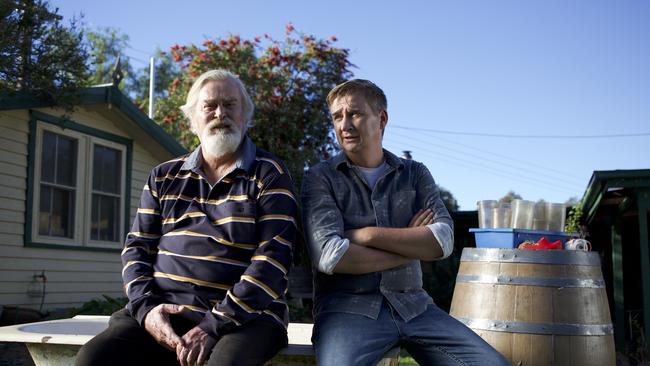 L-R: John Howard and Damian Callinan in a scene from Australian film comedy The Merger