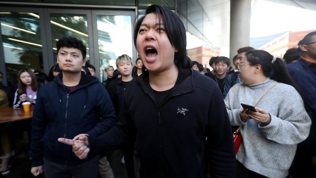 Pro-china students yell at Hong Kong protesters outside the University of South Australia in Adelaide during demonstrations in 2019. Picture: Kelly Barnes