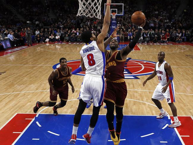 Cavaliers guard Kyrie Irving lays up past Pistons guard Spencer Dinwiddie.