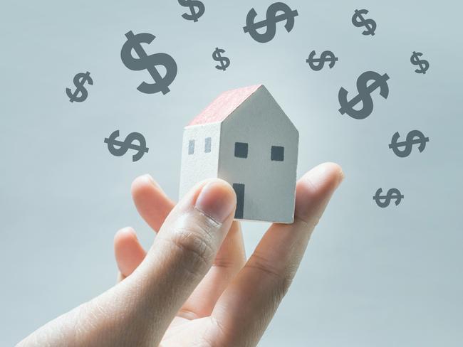 House model on human hands with dollar icon.Savings money and real estate concept. Property investing generic.