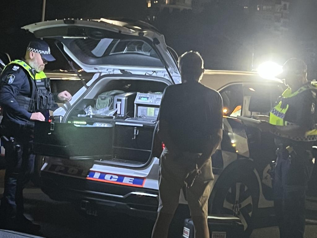 Police conducting a road safety operation at Surfers Paradise on Thursday night test a man for alcohol. Picture: Keith Woods.