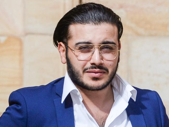 ADELAIDE, AUSTRALIA - NewsWire Photos MAY 12, 2022: Abdul Kadws Mohammad Amin leaves the Adelaide Magistrates Court where he is facing charges of stabbing former Bachelorette contestant Paddy Colliar. PHOTO: NCA NewsWire / Brenton Edwards