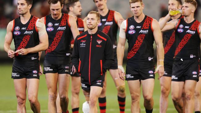 Devon Smith with his knee iced and bandaged after Essendon’s Anzac Day match against Collingwood. Picture: Getty Images