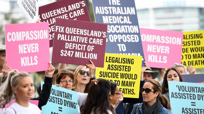 Anti-VAD protesters hold signs outside Parliament House in Brisbane in 2021. Picture: NCA NewsWire / Dan Peled