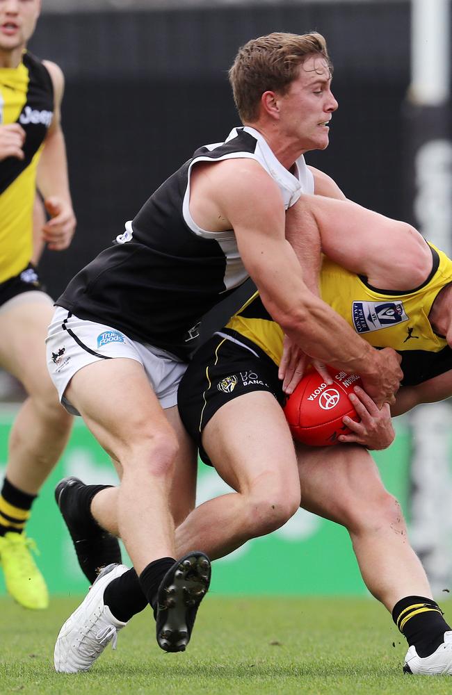 Nick Rippon tackles Richmond’s Nathan Drummond during a VFL clash.