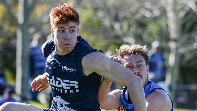 JULY 23, 2022: Joseph Haines kicks under pressure from SturtÃs Mani Liddy during the SANFL game between Sturt and South Adelaide at Unley Oval. Picture: Brenton Edwards