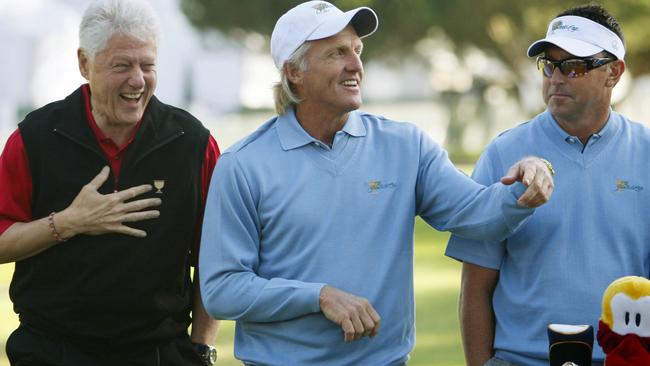 Former US President Bill Clinton, left, joins international team captain Greg Norman and team member Robert Allenby at the Presidents Cup in 2009.