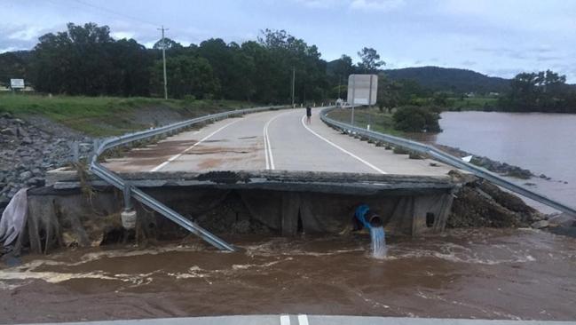 <b/>A large section of the bridge at the John Muntz Causeway at Oxenford has been washed away. Picture: Gold Coast News &amp; Weather