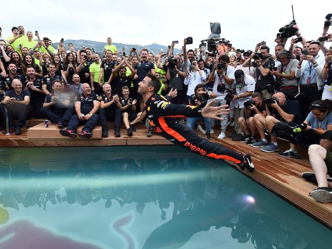 Daniel Ricciardo jumps into a pool as he celebrates winning the Monaco Grand Prix.