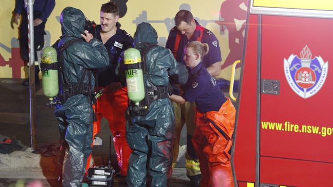 NSW Fire and Rescue workers don protective equipment.