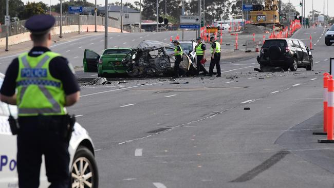 Police at the scene of the fatal crash at the entrance to the Southern Expressway at South Road. Picture: Campbell Brodie