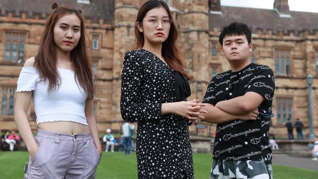 From left, Vivi Han, Jane Sun and Montreal Wang feel lucky to be able to attend their Sydney University course on campus. Picture: John Feder