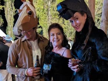 Patricia Ilhan with guests dressed as horses at her 60th birthday