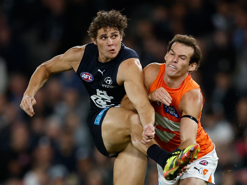 MELBOURNE, AUSTRALIA - APRIL 20: Charlie Curnow of the Blues and Jack Buckley of the Giants in action during the 2024 AFL Round 06 match between the Carlton Blues and the GWS GIANTS at Marvel Stadium on April 20, 2024 in Melbourne, Australia. (Photo by Michael Willson/AFL Photos via Getty Images)
