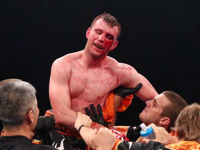 A bloodied Jeff Horn celebrates his stunning victory over Michael Zerafa. Picture: Getty