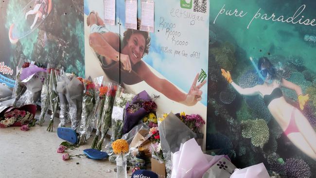 Flowers, hand written notes and other items left by the friends of murder victim Jack Beasley at the scene of the tragedy outside the Surfers Paradise IGA. Photographer: Liam Kidston.