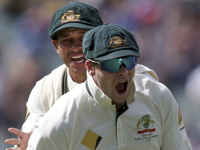 Steve Smith and Usman Khawaja celebrate a South African wicket.