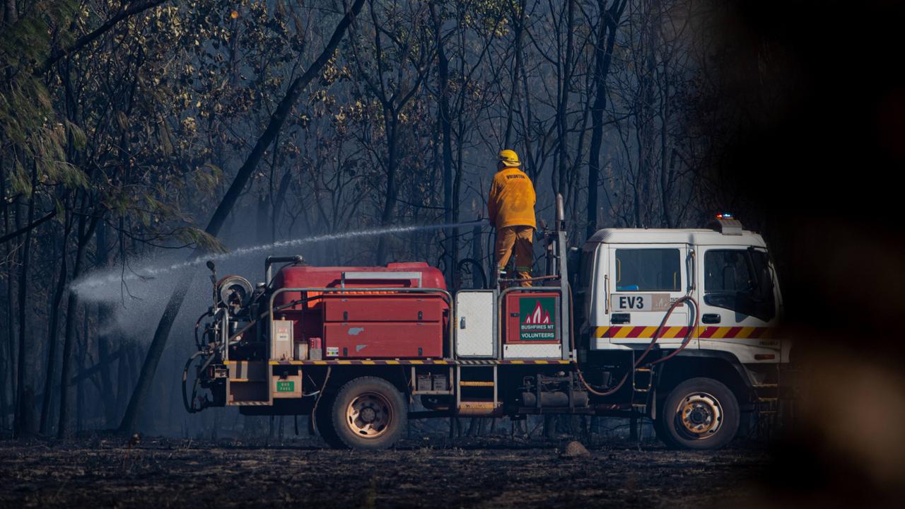 About eight properties were under threat in the Livingstone area on July 30 as a bushfire ripped through the area. Three aircraft, four helicopters and 20 volunteer crews and Bushfires NT fireys battled together to contain the blaze on Perentie Rd. One firefighter was injured and admitted to hospital with burns. Picture: Che Chorley