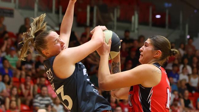 PERTH, AUSTRALIA - MARCH 03:  Emily Potter of the Lynx charges into Mikaela Ruef of the Fire during game two of the WNBL Semi Final series between Perth Lynx and Townsville Fire at Bendat Basketball Stadium, on March 03, 2024, in Perth, Australia. (Photo by James Worsfold/Getty Images)