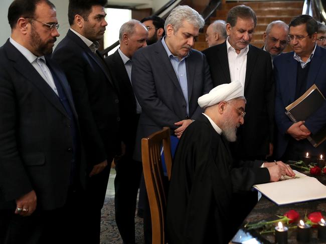 President Hassan Rouhani signing a book carrying the names of the victims of the Ukraine Flight 752, following a cabinet meeting in Tehran. Picture: AFP