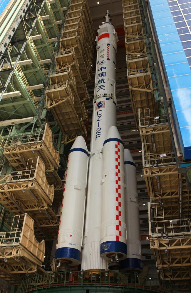 The spacecraft of Shenzhou X is seen on top of the Long March 2F launch vehicle. The spacecraft carried three astronauts to visit the Tiangong-1 space module. Picture: Getty