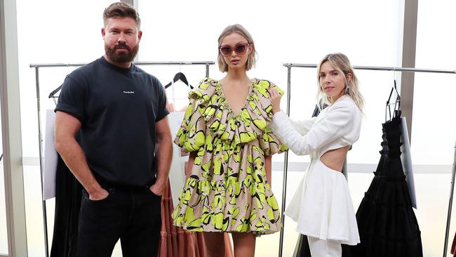 Aje designers Adrian Norris and Edwina Forest with model Lucy Baddeley. Picture: Tim Hunter.