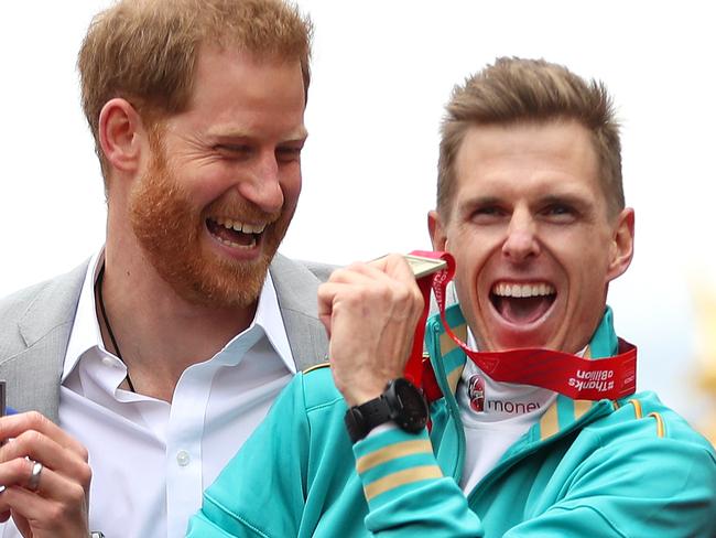 LONDON, ENGLAND - APRIL 28: Derek Rae of Great Britain (2nd), Michael Roger of Australia (1st) and Abdehadi El Harti of Morocco (3rd) all celebrate their respective finishing positions in the T46 Men's race with Prince Harry, Duke of Sussex during the 2019 Virgin Money London Marathon in the United Kingdom on April 28, 2019 in London, England. (Photo by Naomi Baker/Getty Images) *** BESTPIX ***