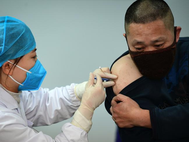 A medical worker vaccinates a man against COVID-19 at a health centre in Hefei, in eastern China's Anhui province, last week. Picture: AFP