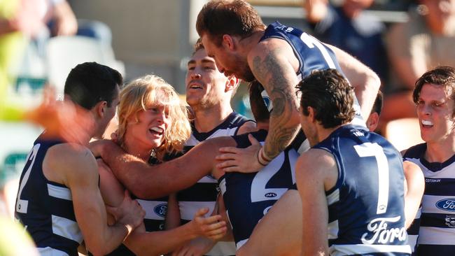 Dempsey’s teammates certainly didn’t miss out on the celebrations when he kicked his first goal. Picture: AFL Photos via Getty Images