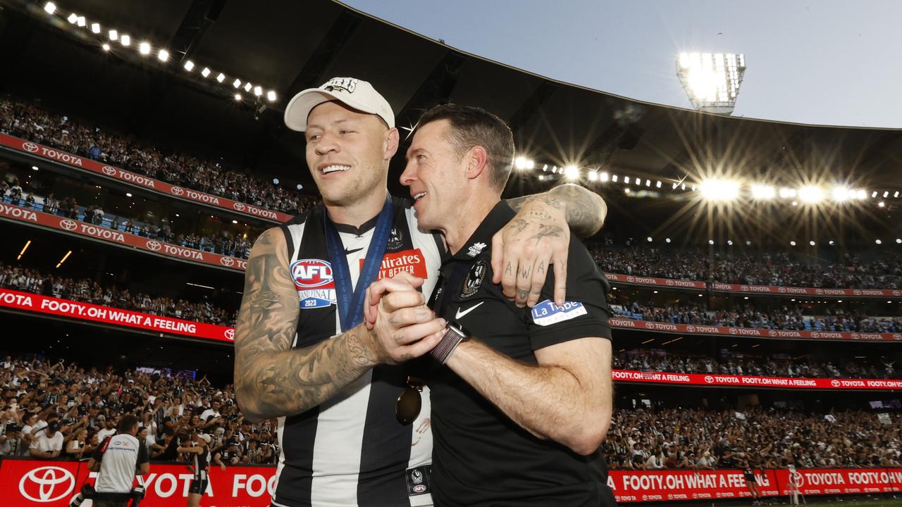 Jordan De Goey celebrates with Magpies coach Craig McRae. Picture: Darrian Traynor