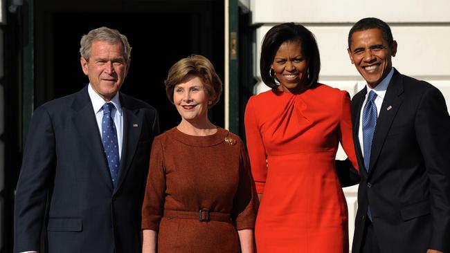 George W Bush, Laura Bush, Michele Obama and Barack Obama stand outside the Diplomatic entrance of the White House in 2008.