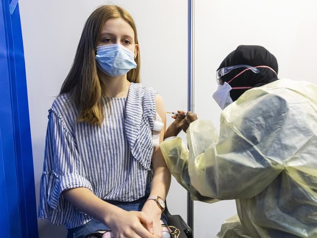 Immy Martin, 14, receives a Pfizer vaccine at Whitten Oval. Picture: Daniel Pockett