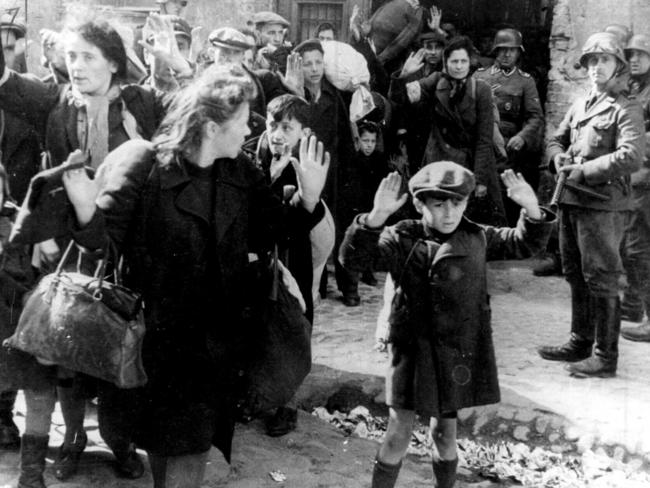 German Army troops leading Polish Jewish civilians from Warsaw ghetto in Poland to execution during World War II. holocaust jews two WWII historical/World/War/1939/45/Jews