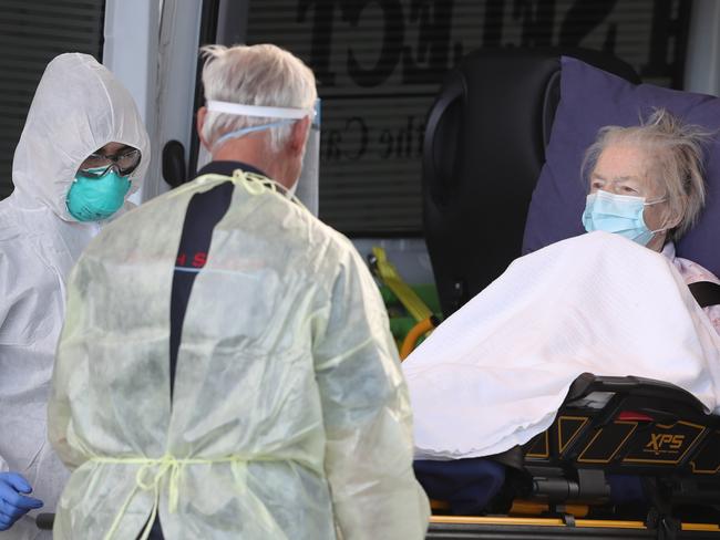 MELBOURNE, AUSTRALIA - NewsWire Photos JULY 30, 2020: A resident is taken to transport out of Epping Gardens Aged Care home which has a COVID-19 breakout. Picture: NCA NewsWire /David Crosling