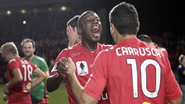 Bruce Djite and Marcelo Carrusca following Adelaide United’s FFA Cup final win over Perth Glory. Picture: Sarah Reed