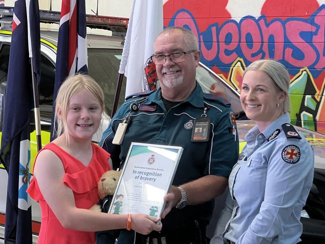 Aubree Tidyman with assistant commissioner Peta Thompson and paramedic Richard Taylor at an awards ceremony on Thursday in Toowoomba. Picture: Marcus de Blonk Smith