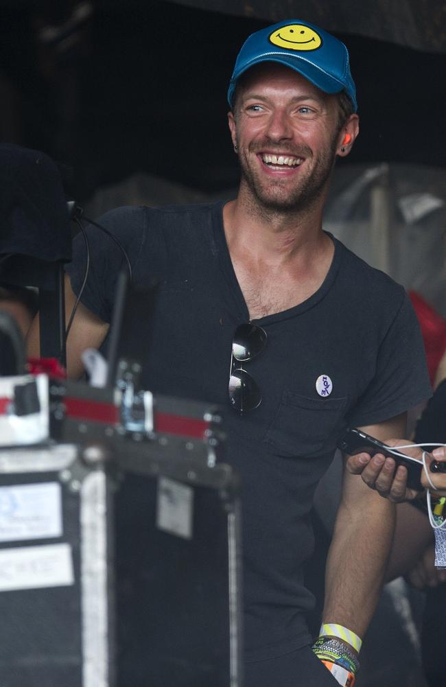 Chris Martin, front man of Coldplay, prepares to watch American singer Pharrell Williams perform perform on the Pyramid Stage at the 2015 Glastonbury Festival. Picture: AFP