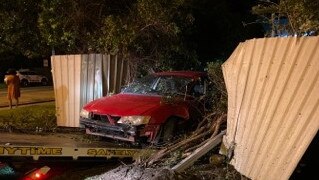 A learner driver, 18, crashed through the front fence of a Rasmussen home early on Sunday morning after she was allegedly drinking. Photo: 7 News Townsville