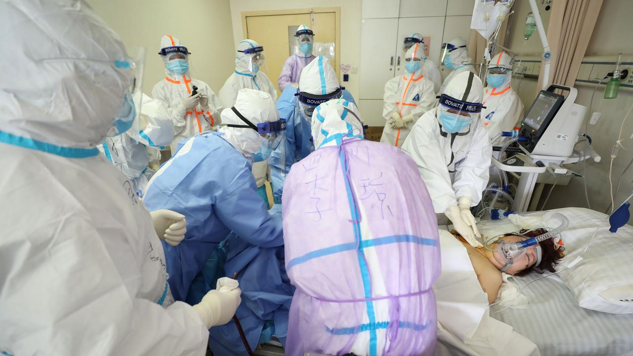 Medical staff treating a critical patient infected by the coronavirus at the Red Cross hospital in Wuhan. Picture: STR / AFP/ China OUT