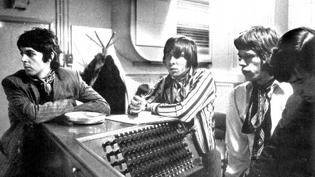 Paul McCartney of The Beatles at a Rolling Stones recording session with the band’s manager Andrew Loog Oldham and frontman Mick Jagger during the 1960s.