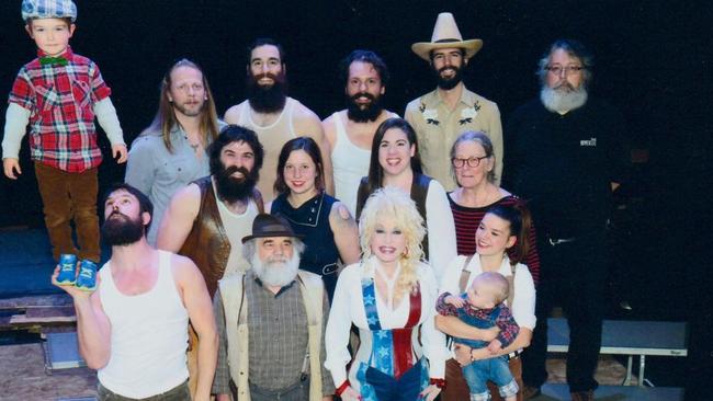 Country legend Dolly Parton poses with the incredible troupe. Picture: supplied