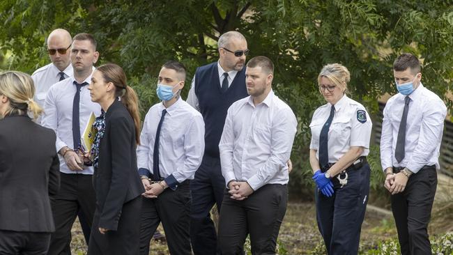 Thomas Nichols, Thomas Pinnington, Jeremy Dale Sandel and Kain Mazomenos, pictured left to right in handcuffs. Picture: NCA NewsWire