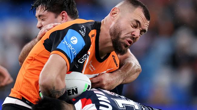 SYDNEY, AUSTRALIA - JUNE 30: David Klemmer of the Tigers is tackled by the Roosters defence during the round 17 NRL match between Sydney Roosters and Wests Tigers at Allianz Stadium, on June 30, 2024, in Sydney, Australia. (Photo by Brendon Thorne/Getty Images)