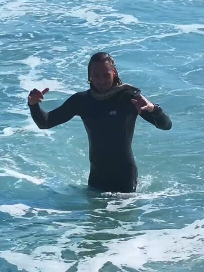 Surfer Higor Fiuza went viral this week after footage of him and his pet carpet python surfing at Rainbow Bay, near Snapper Rocks, was shared online. Picture: Instagram/ @skymonkey5