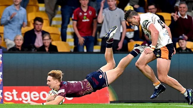 Tate McDermott of the Reds scores a try. Picture: Bradley Kanaris/Getty Images