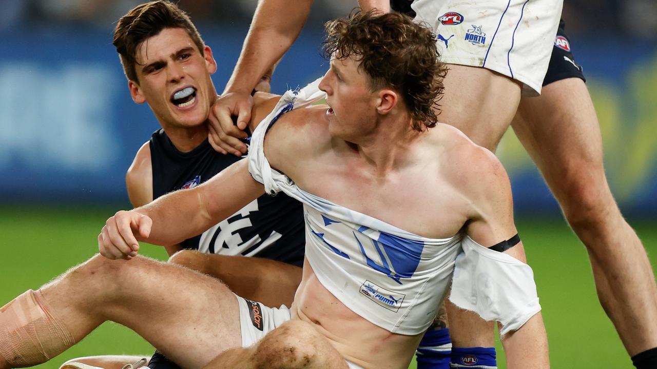 Nick Larkey of the Kangaroos and Lewis Young of the Blues clash. Photo by Michael Willson/AFL Photos via Getty Images.