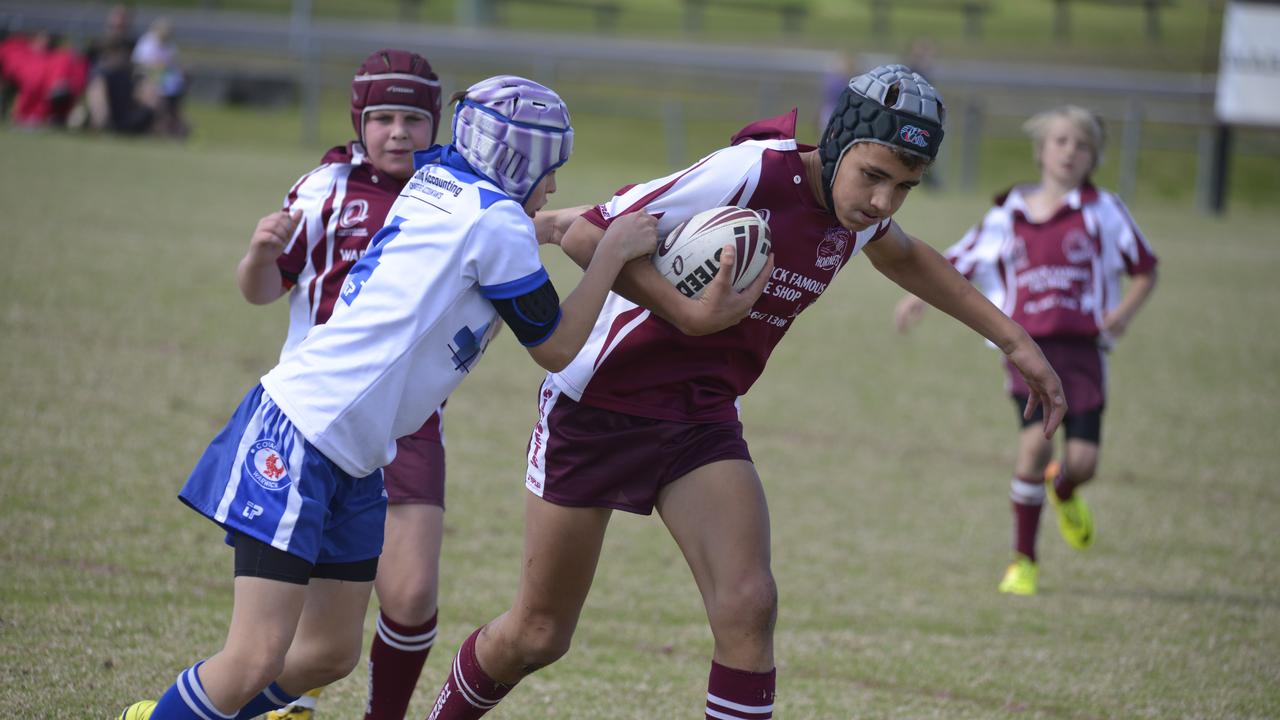 Collegians player Sam Ogden tackles Eastern Suburbs forward Brendan Hoffman in the under-12 local rugby league derby on Saturday. Photo Gerard Walsh / Warwick Daily News