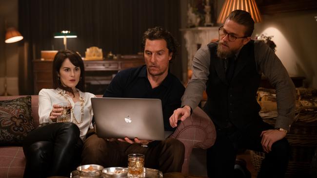 Michelle Dockery, Matthew McConaughey and Charlie Hunnam in a scene from the movie The Gentlemen.