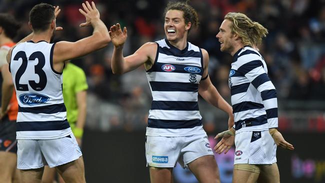 Wylie Buzza celebrates a goal on debut with teammates Aaron Black and Cam Guthrie. Picture: AAP